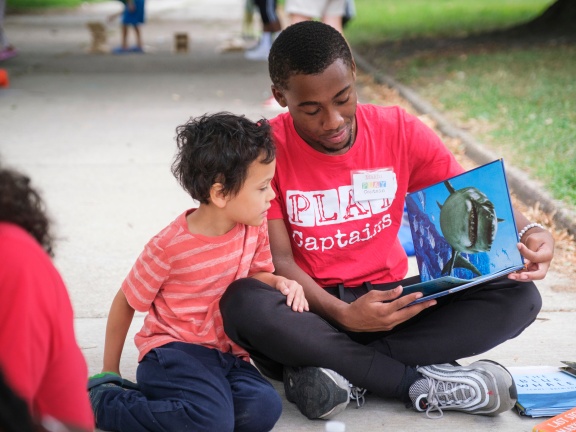 Children reading in park