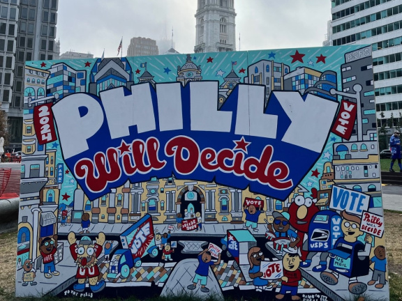 A mural about voting that says 'Philly Will Decide'